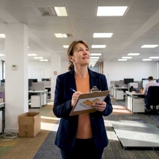 Manager surveying office lighting installation